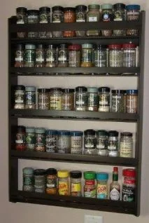 Dave's 5 Tier Wood Spice Rack Plan: 5 Tier racks are available in Oak, Cherry, Walnut, Maple, Pine, Ash, Red Elm & Aromatic Red Cedar woods. Your selection of hand-rubbed Danish oil wood finishes. When displayed your kitchen wall, you will have easy access to your spices and herbs. Long, open shelves provide ample space to create a neat and organized wall display that you will be thank full for! Over all measurements; 20″ wide, 29″ tall, 3″ deep. 5 shelves 3 inches deep; will hold all your McCormick Spice containers 2½” inches deep; 2 shelves with 5 inch shelf spacing, 2 shelves with 6 inch shelf spacing. Plus all the space above the top shelf. Shipping free in the United States.Custom made counter spice racks for your home contact Dave the spice rack maker.
