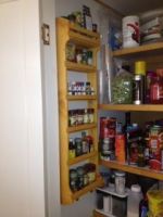 Classical Spice Rack Design. Bottom and top shelves are wider. Custom pine wood rack in classical design.